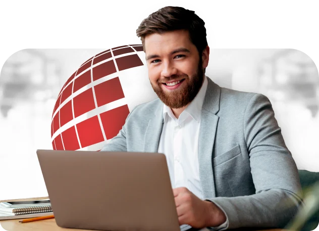 a man wearing a grey suit using a laptop